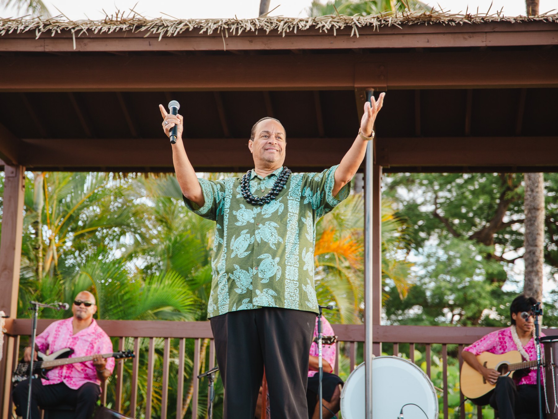 a little girl standing in front of a building
