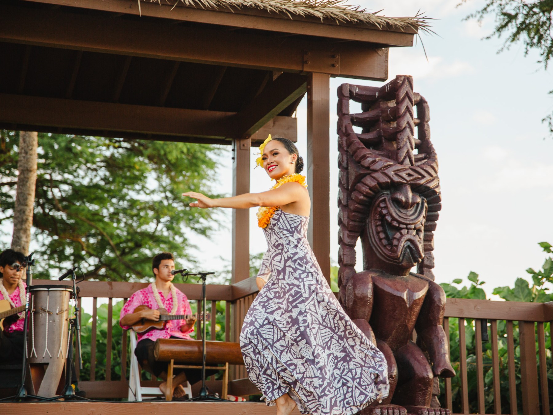 a group of people sitting at a zoo