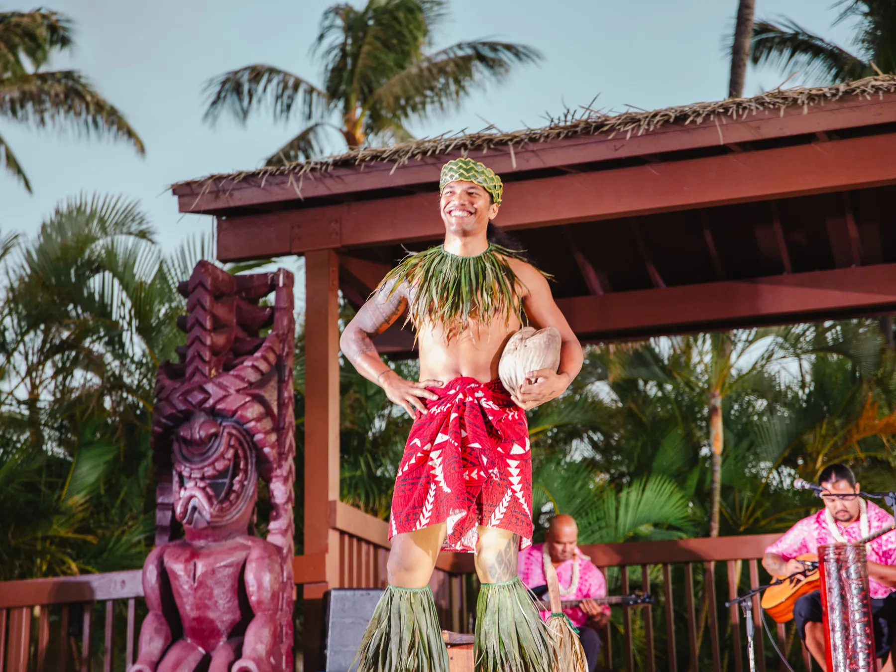 a person standing next to a christmas tree